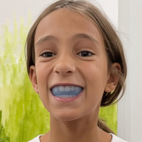 Smiling girl wearing the blue Functional Activator mewing mouth guard