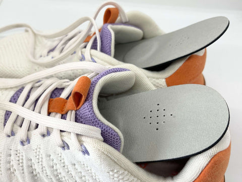 Therapeutic insoles for running shoes providing heel pain relief